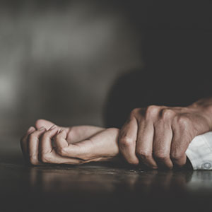 Hand gripping girl's wrist, symbolizing Sex Crime